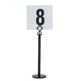 A black powder coated metal number card holder stand holds a white square card displaying a bold black number 8. The stand has a round, flat base and a clip securing the card upright. The background is plain white.