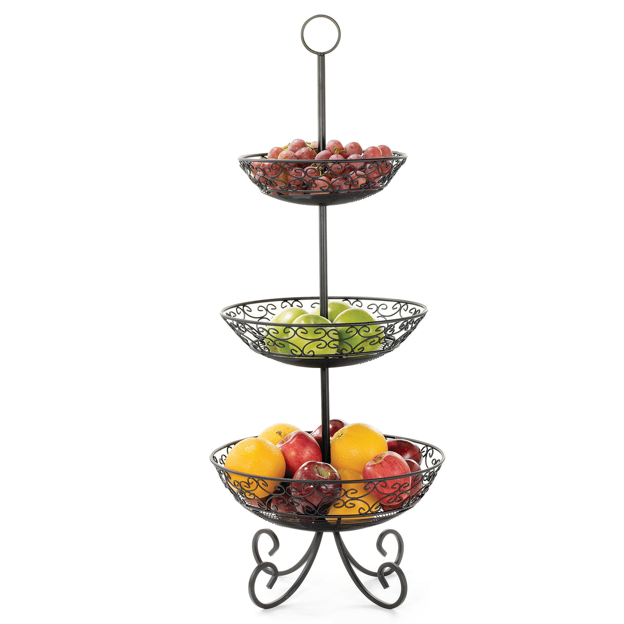 A three-tiered basket from the Mediterranean Collection Basket holds red grapes on top, green apples in the middle, and a mix of red apples and oranges below. Its black powder coated metal frame features ornate scrollwork and a decorative base.