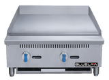 A commercial stainless steel countertop griddle with two blue control knobs, ventilation slots, and a BLUELAA logo on the lower right. This heavy duty gas griddle has a raised back and sides, sturdy legs, and a removable drip tray below.