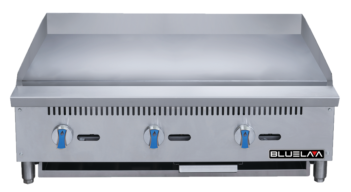 A stainless steel heavy duty gas griddle with three blue control knobs, a smooth flat cooking surface, vent slots above the knobs, sturdy legs, and the BLUELINE logo on the lower right front panel. This 36 inch gas griddle is clean and unused.