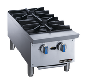 A heavy duty stainless steel countertop gas range with two black cast iron burners, blue-accented control knobs, sturdy legs, and the “Blueline” brand on front. The modern design resembles a professional hot plate and features a spotless surface.