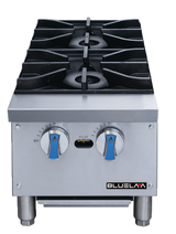 A heavy duty stainless steel countertop gas range featuring two black cast iron burners, two blue-handled control knobs labeled "OFF" and "MAX," a central pilot light, and the "BLUELAA" logo on the lower right front.