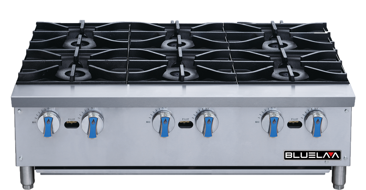 A commercial stainless steel gas range with six large black burners, blue and silver control knobs, and BLUELA branding on the lower right front panel. The countertop surface is clean, featuring a modern and industrial design.