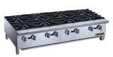 A heavy duty stainless steel commercial gas range with eight black cast-iron burners, blue and silver control knobs, and short metal legs. The Blueflame logo appears on the lower right front panel. Ideal for countertop use, set against a white background.