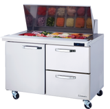 A commercial stainless steel mega top prep table features a raised, open food compartment for chopped ingredients. Below are two drawers and a door for refrigerated storage, making this unit the ideal sandwich prep table on four caster wheels.