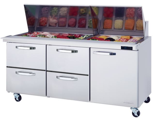 A stainless steel Mega Top Sandwich Prep Table with a glass lid open, revealing neatly arranged containers of sliced meats, vegetables, and cheeses. Below the prep area are three pull-out drawers and a door, all on wheels for mobility.