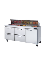 A commercial three-section stainless steel sandwich prep table with four drawers and a compartment, topped with a glass-covered section holding assorted food ingredients in transparent containers. The unit sits on wheels against a plain white background.