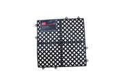 A black plastic bar mat with a diamond-shaped lattice pattern is shown against a white background. The non-slip mat features small circular connectors on the edges and a product label in the upper left corner.