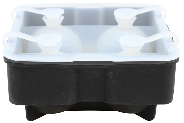 A black and white silicone ice sphere tray with four large round compartments, each sealed with a white cap featuring a looped handle, designed to make spherical ice balls. The tray appears empty and is shown from a slightly low, front-facing angle.