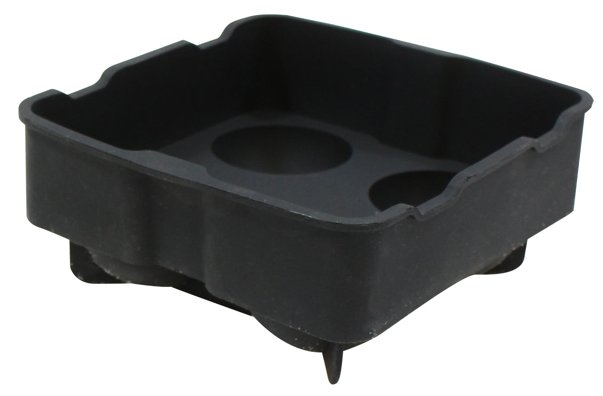 A black, square silicone ice tray with raised edges and four rounded corners. The tray features a slightly tapered shape, three circular indentations in the base, and four short legs or pegs underneath for support. Dishwasher safe for easy cleaning.