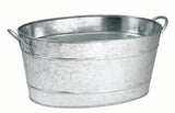 A large, oval-shaped TableCraft beverage tub made of galvanized steel with two side handles. The tub features a shiny, textured surface and is empty, shown against a plain white background.