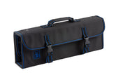 A black rectangular tool bag with blue stitching, a handle on top, and two front buckle closures. Designed as a knife case, it holds 10 knives securely. The flap covers the front and sides, featuring a blue logo of a wrench inside a flask. Plain white background.