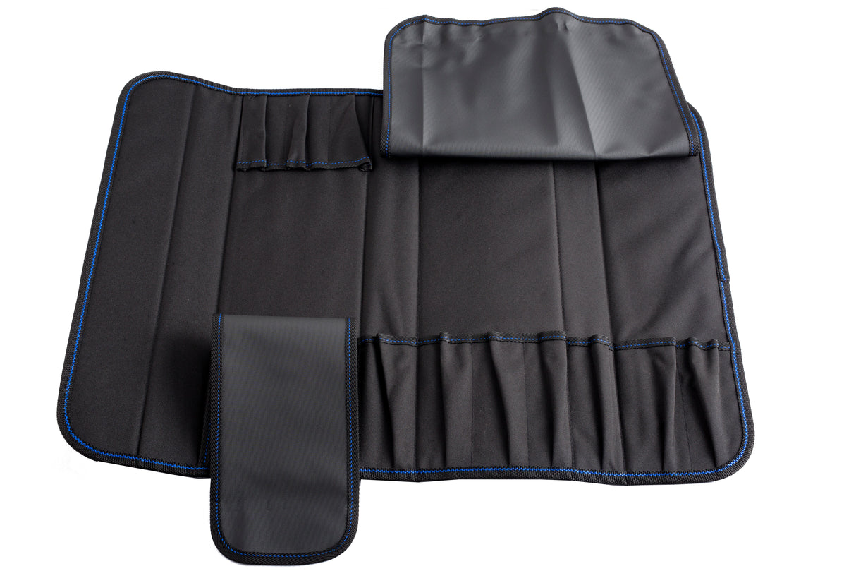 A black, foldable knife case made of synthetic material is laid open, showing multiple pockets of various sizes that holds 10 knives or utensils. The roll has blue stitching and two flaps for securing the contents and is dishwasher safe.