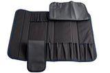 A black, foldable knife case made of synthetic material is laid open, showing multiple pockets of various sizes that holds 10 knives or utensils. The roll has blue stitching and two flaps for securing the contents and is dishwasher safe.