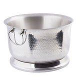 A round, 6 gallon stainless steel ice bucket with a flared rim, two curved side handles, and a wide base. The reflective surface shows subtle shadows, and the textured pattern gives this beverage tub a stylish, elegant look.