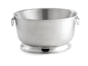 A large, round stainless steel ice bucket with a hammered texture, two small side handles, and a wide, stable base. The double wall design keeps beverages cold. The bucket is empty and set against a plain white background.