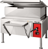 A commercial stainless steel Vulcan braising pan with a raised lid, red control panel, temperature dial, and lever stands on four legs. The electric 40-gallon basin tilts forward with FastBatch heating technology for efficient pouring into the attached metal pan.