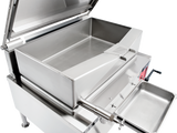 A large stainless steel commercial braising pan with a 40-gallon capacity features an open lid, angled spout, and strainer insert. A drip pan sits below the spout to catch liquids. The gas-powered skillet and surrounding surfaces are clean and industrial in design.