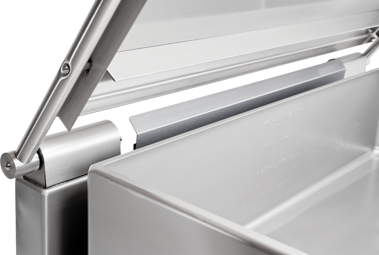 Close-up of a stainless steel tilting braising pan, focusing on the hinge and edge of a large rectangular container with a partially open lid. Smooth metal surfaces, visible welds, and rivets give this 40 gallon capacity unit a modern, industrial look.