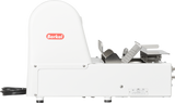 Side view of a white Berkel MB1/2STD meat slicer with a rounded motor cover, red logo, metal slicing mechanism, tray, and adjustment knobs. Designed for countertop use, the durable metal build offers clean lines and an industrial feel.