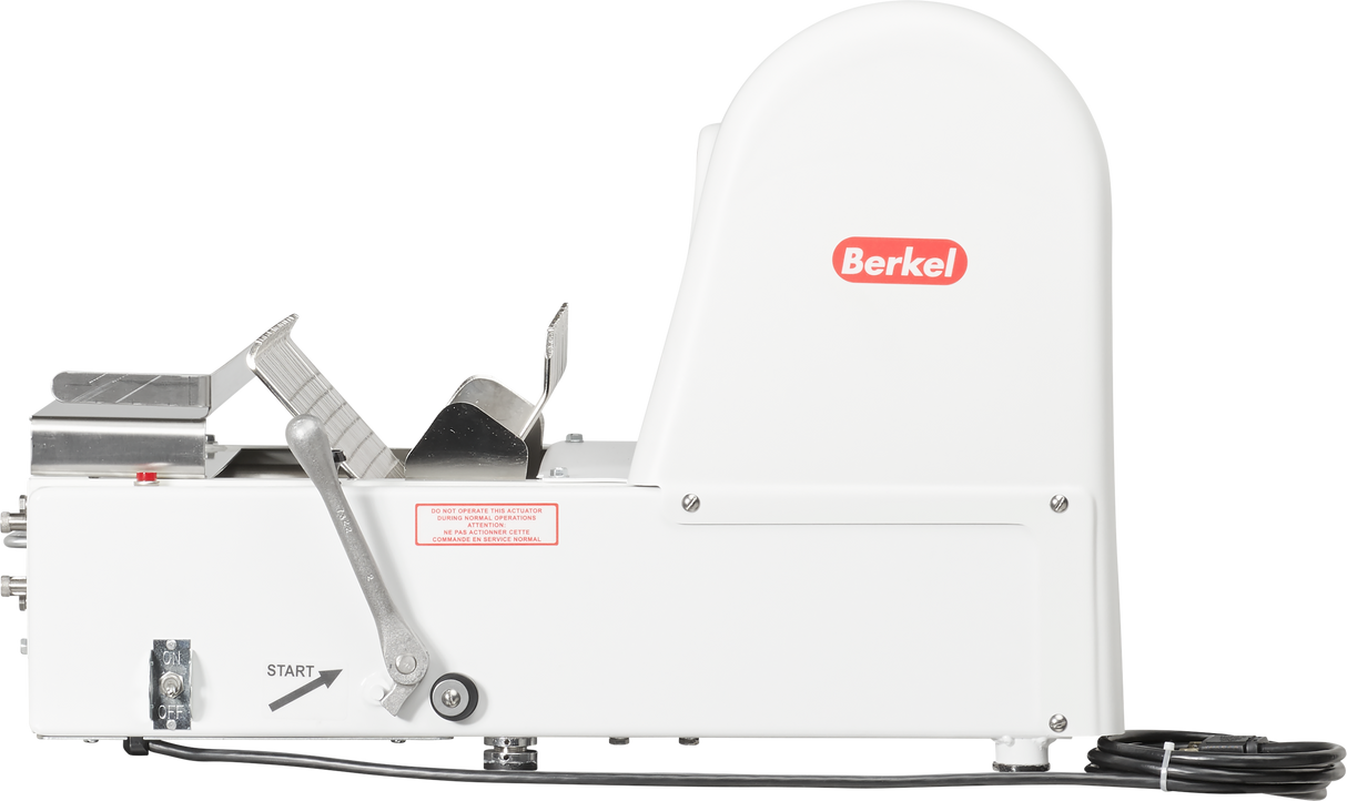 A white Berkel commercial meat slicer is shown in profile on a countertop. The machine features a lever, power cord, and START label on the base. The domed blade cover and metal components for holding food are visible on the left side.