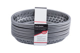 A stack of gunmetal, oval-shaped plastic classic baskets with a grid pattern. A paper label in English, Spanish, and French notes they are heat resistant, microwave and dishwasher safe, and branded by The Great Plate.
