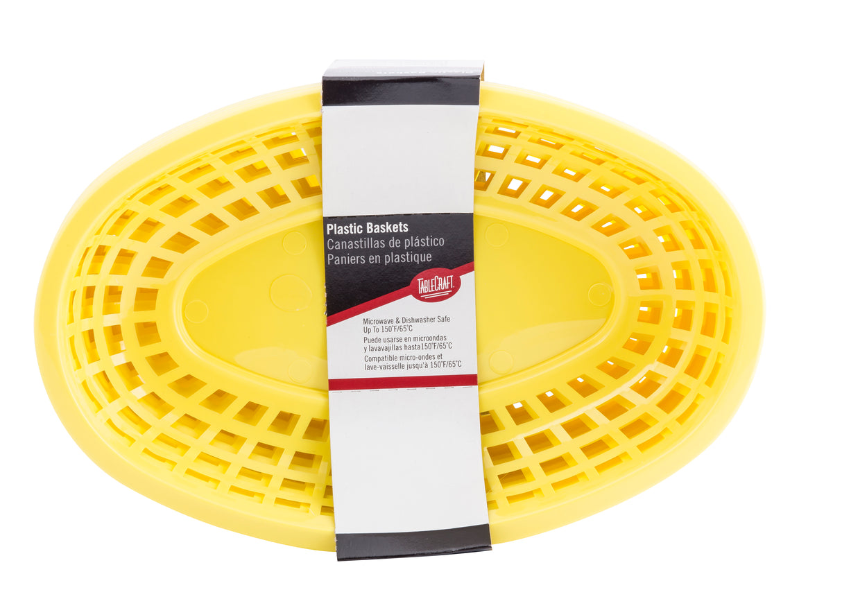 A bright yellow oval plastic basket with slotted sides, viewed from above. A white product label with English and Spanish text wraps around the center, describing this heat resistant, classic basket as suitable for microwave and dishwasher use.