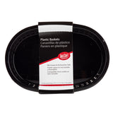 A stack of black oval plastic baskets with vent holes along the rim. The label notes these Chicago Baskets are microwave and dishwasher safe, heat resistant baskets, and displays the TableCraft logo in English, Spanish, and French.