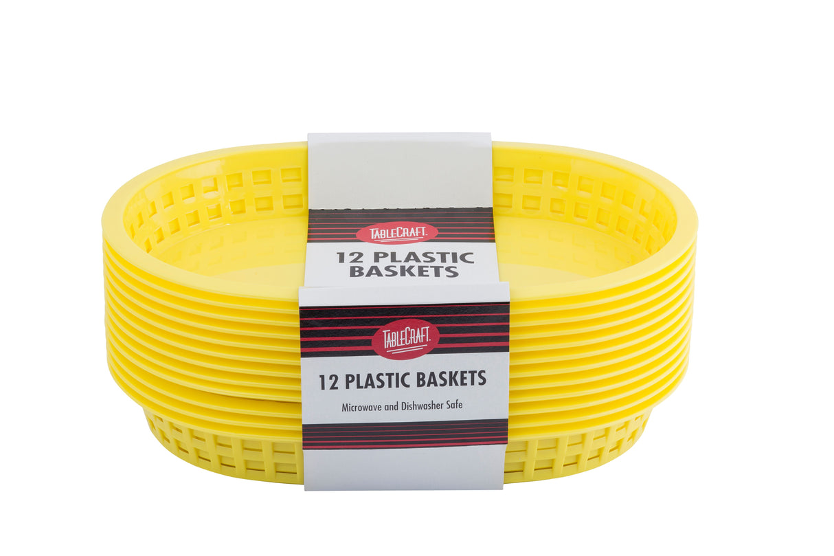 A stack of six bright yellow, oval-shaped plastic serving baskets with grid-style sides, wrapped with a label reading TableCraft 12 Plastic Baskets, Microwave and Dishwasher Safe, Chicago Baskets, against a white background.