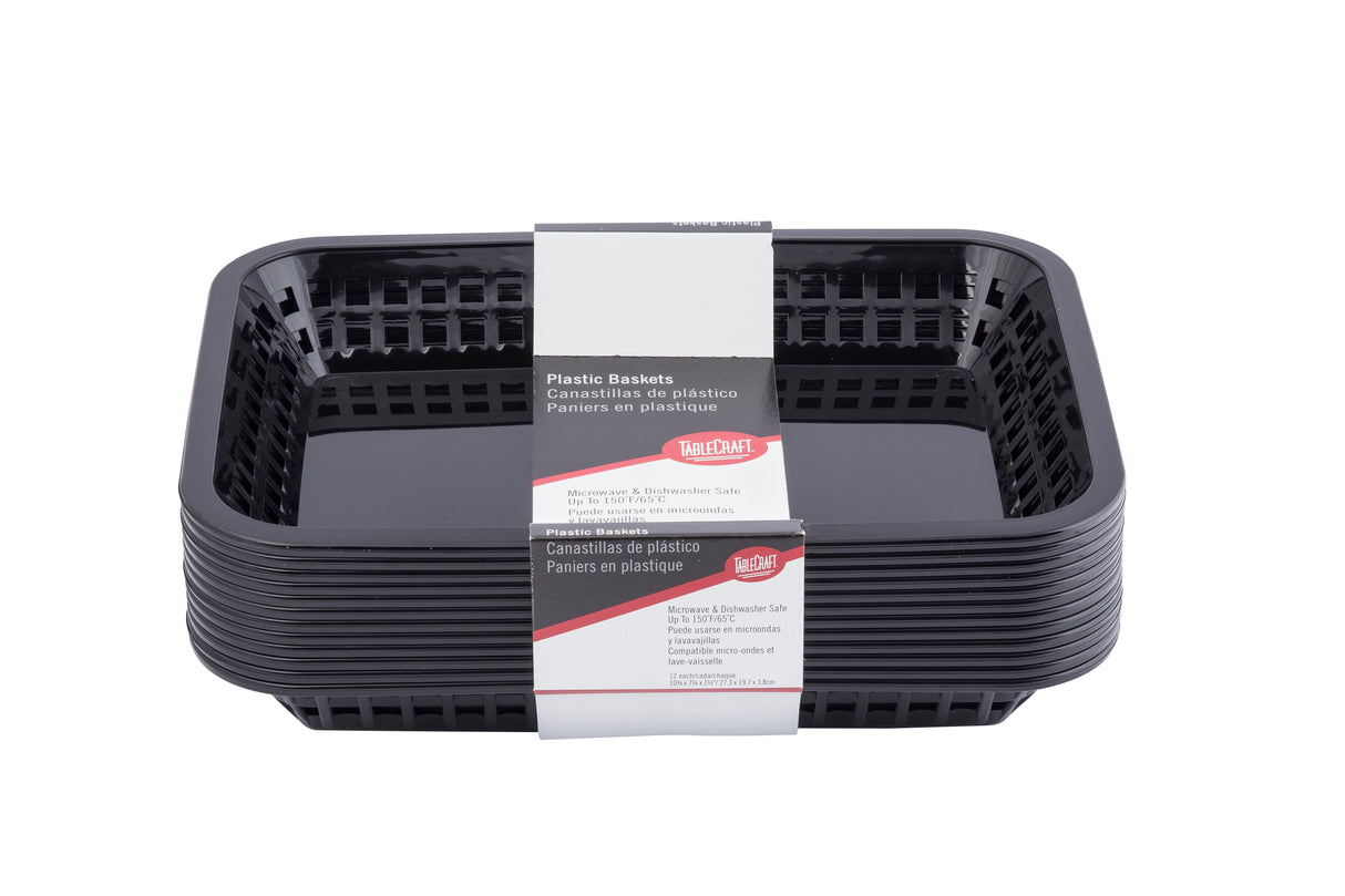 A stack of black rectangular Cash & Carry Grande Baskets, packaged with a white and red paper label reading “Plastic Baskets” in multiple languages. These dishwasher safe baskets feature open-slotted sides and a glossy finish.