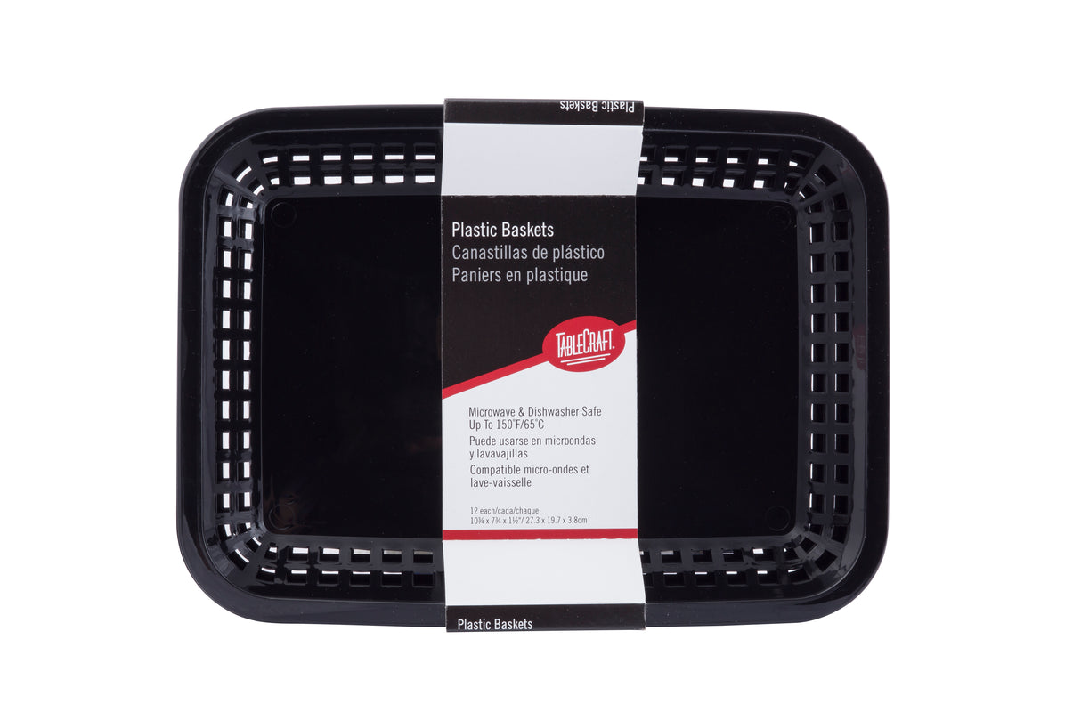 A black rectangular plastic Cash & Carry Grande Basket with vented sides is shown from above. The label states “Plastic Baskets” in English, Spanish, and French, noting that these are dishwasher safe baskets and microwave safe. Brand: The CHAIR.
