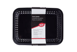 A black rectangular plastic Cash & Carry Grande Basket with vented sides is shown from above. The label states “Plastic Baskets” in English, Spanish, and French, noting that these are dishwasher safe baskets and microwave safe. Brand: The CHAIR.