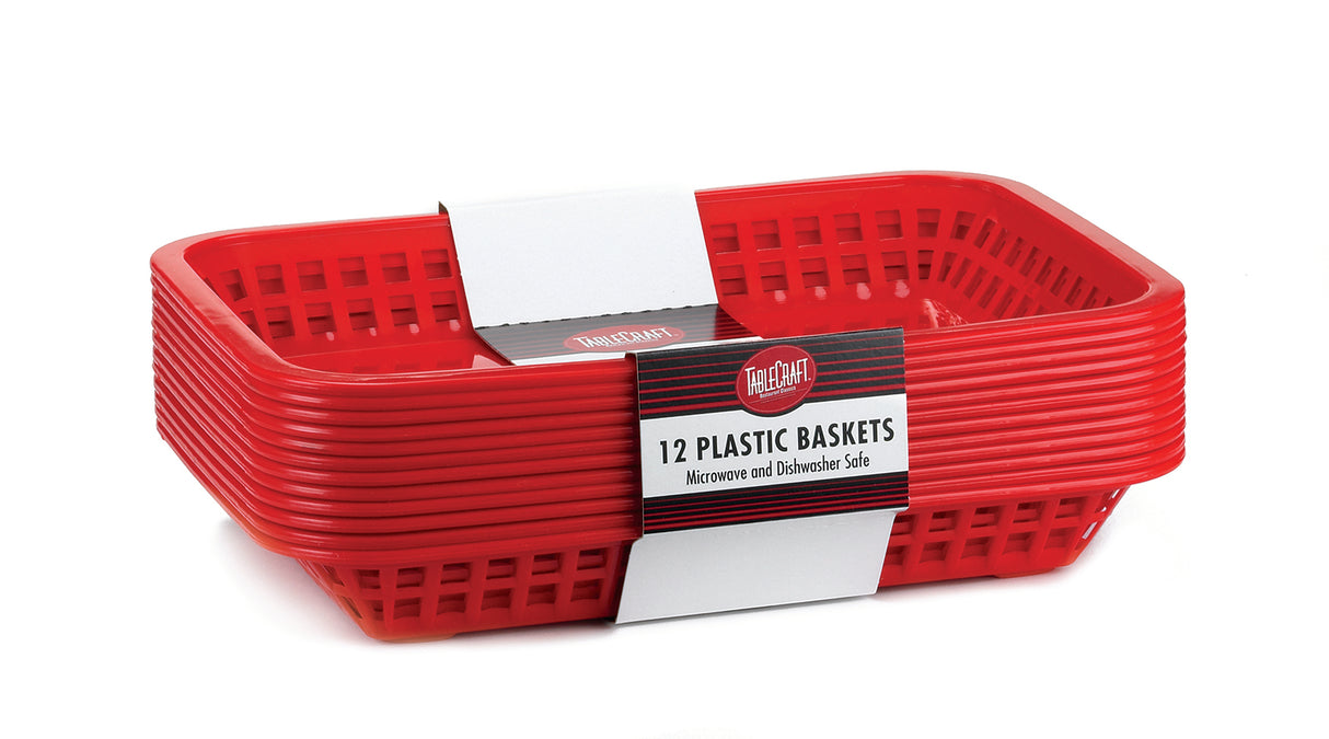 A stack of twelve red Cash & Carry Grande Baskets, rectangular with slotted sides and a slightly glossy finish, wrapped in a label reading “12 Plastic Baskets, Microwave and Dishwasher Safe.” These are durable, dishwasher safe baskets.