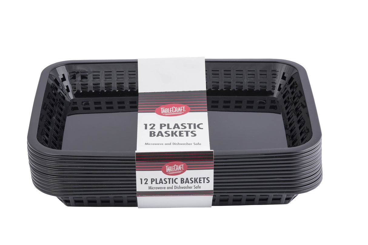 A stack of black rectangular dishwasher safe baskets with vented sides. A white label across the middle reads “TableCraft 12 Plastic Baskets—Microwave and Dishwasher Safe.” These nested baskets are shown against a white background.