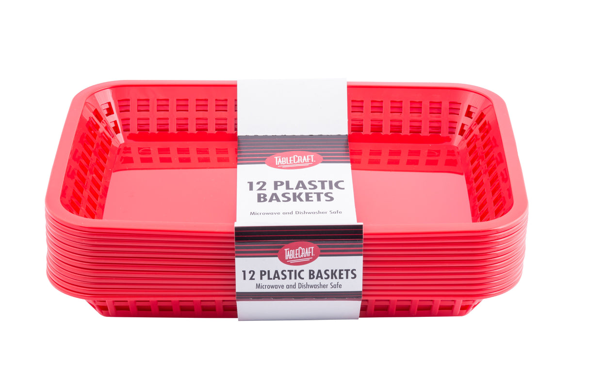 A stack of red rectangular cash and carry baskets with slotted sides, wrapped in a white and gray paper band labeled “TableCraft 12 Plastic Baskets, Microwave and Dishwasher Safe” against a white background.