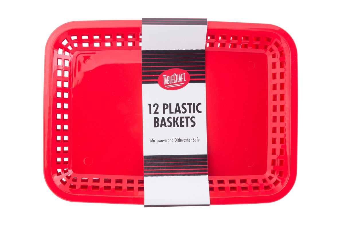 A pack of bright red rectangular dishwasher safe baskets, stacked together with a white and black label reading TableCraft, 12 Plastic Baskets. The baskets have ventilated sides, rounded corners, and are microwave and dishwasher safe.