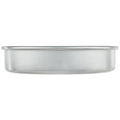 A round, shallow aluminum cake pan measuring 9 x 2 is shown from the side against a white background. The pan has straight edges, a smooth finish, and a slightly rolled rim around the top.