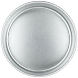A round, plain, silver aluminum cake pan or platter viewed from above. The pan has a smooth surface with a subtle brushed texture and a slightly raised edge, reflecting light evenly across its surface.