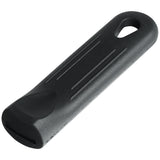 A black, elongated plastic Chef Approved tool with rounded edges, shallow grooves on top, and a teardrop-shaped hole at one end for hanging. The opposite end is flattened and slightly wider, ideal as a Silicone Pan Handle or Pan Handle Sleeve for safe gripping.