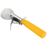 A metal disher with a round head and a bright yellow handle is shown. The scoop features a thumb press trigger mechanism for easy release of ice cream. The background is plain white.