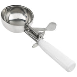 A chef-approved metal ice cream disher with a round bowl and trigger release mechanism features shiny stainless steel construction, a thumb press, and a white plastic handle, shown on a plain white background.