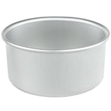 A chef-approved aluminum cake pan is showcased as a sleek silver bowl against a white background.