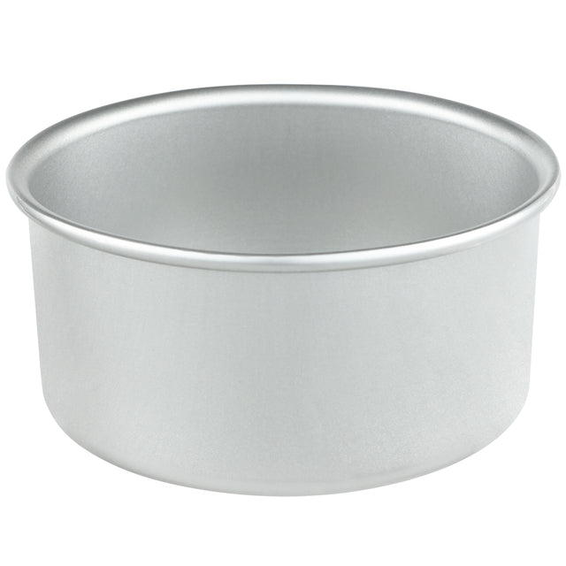 A chef-approved aluminum cake pan is showcased as a sleek silver bowl against a white background.