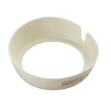 A round, off-white plastic Dispenser ID Collar with slightly raised sides and a small notch on one edge. The inside is smooth, and the outer surface features partial brown text. Photographed on a white background, it's made by TableCraft Products.