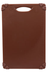 A brown rectangular grippy cutting board with a handle at the top. Raised measurement markings in centimeters run along the left and right edges. The four corners are reinforced with triangular grips. The smooth surface is unmarked and dishwasher safe.