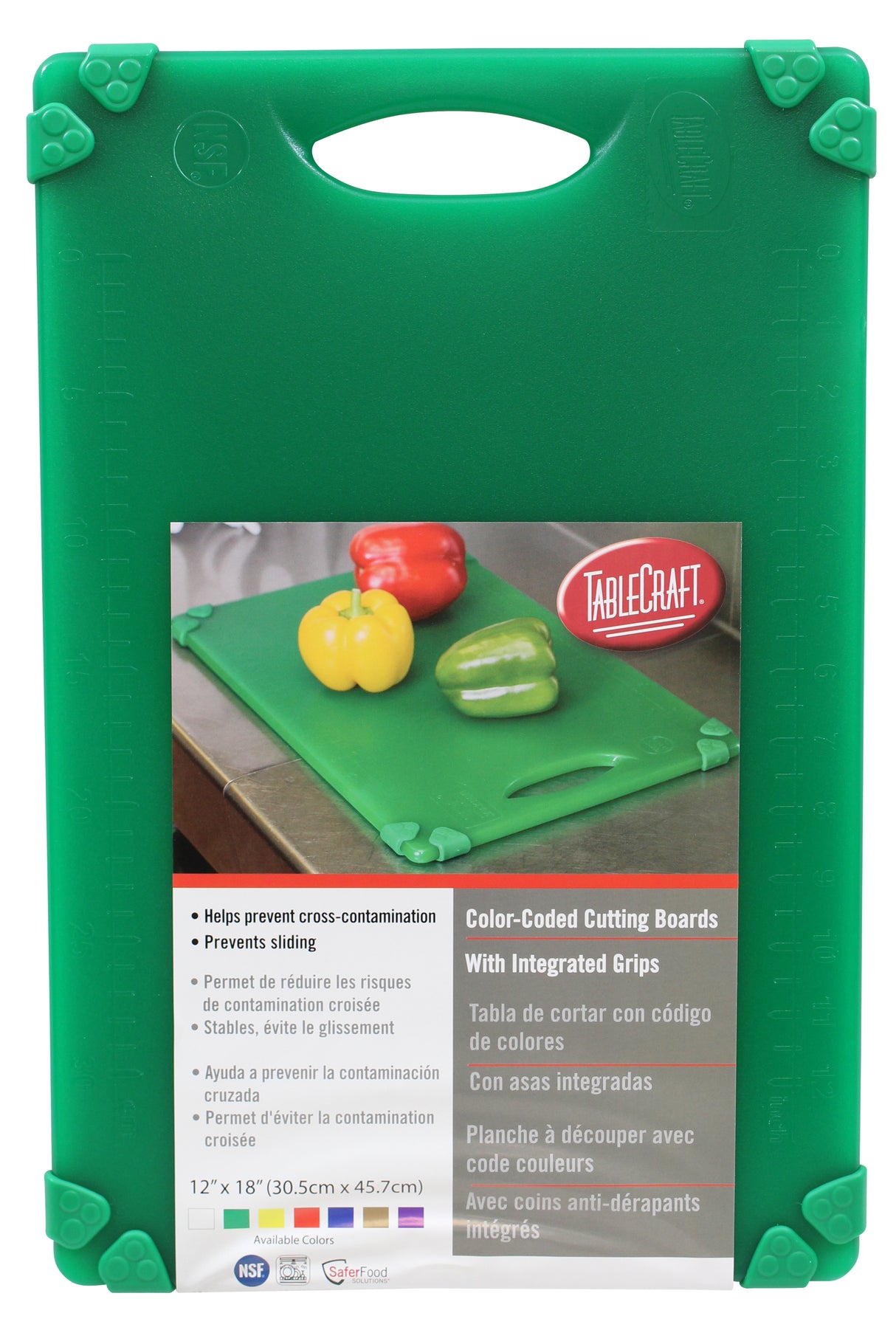 A green anti-slip cutting board with integrated grips is shown, packaged upright. The label displays the TableCraft logo, a photo with colorful bell peppers, product details in three languages, and board dimensions: 12x18.