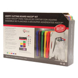 A box displaying the TableCraft Grippy Cutting Board HACCP Kit with six dishwasher safe cutting boards and a white stand. The box details the kit’s components in English, Spanish, and French, showing a photo of the boards arranged in the stand.