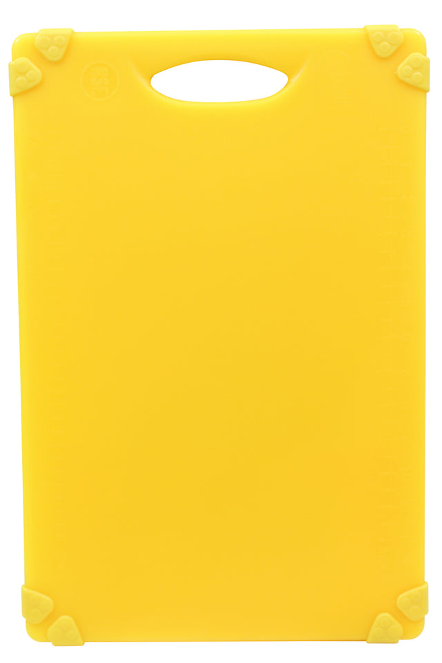 A bright yellow, anti-slip cutting board with rounded corners and a built-in handle at the top. Each corner features a triangular yellow rubber grip. The surface is plain, with a subtle measurement scale along the right edge.