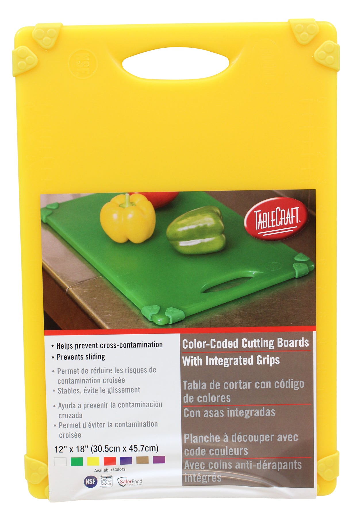 A yellow package contains a green TableCraft HACCP cutting board. The packaging shows bell peppers, highlights color-coding to prevent cross-contamination, integrated grips for a grippy cutting board, and the 12x18" (30.5x45.7cm) size.