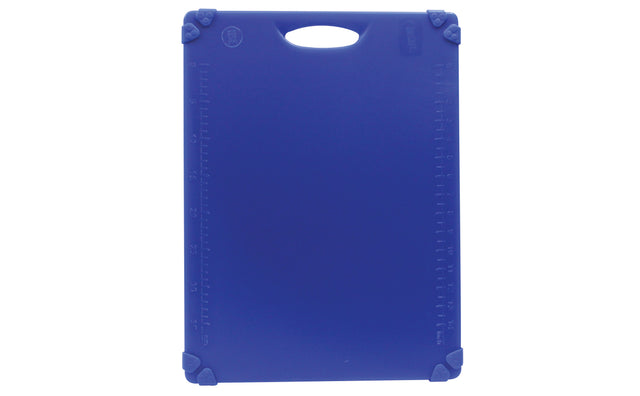 A rectangular blue NSF cutting board with a handle slot at the top. Measurement markings line the edges, and rubberized grips on each corner offer stability. The grippy cutting board is clean and placed vertically against a white background.
